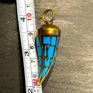Horn pendant in turquoise and burnished gold color